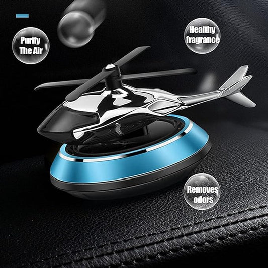 Solar-powered car fragrance diffuser helicopter design on dashboard